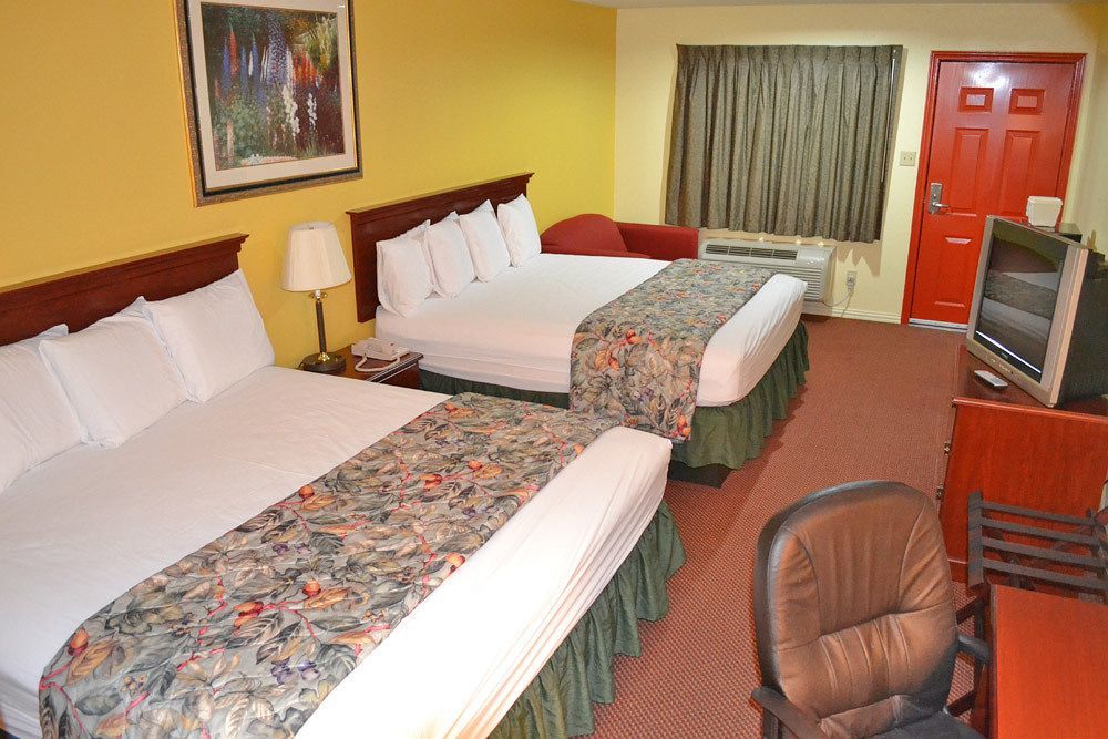Executive Inn & Suites Магнолия Екстериор снимка