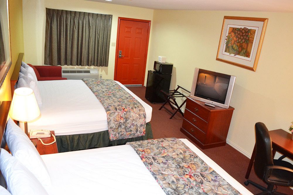 Executive Inn & Suites Магнолия Екстериор снимка