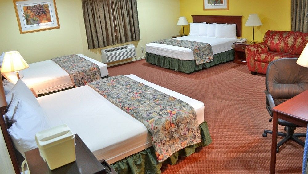 Executive Inn & Suites Магнолия Екстериор снимка